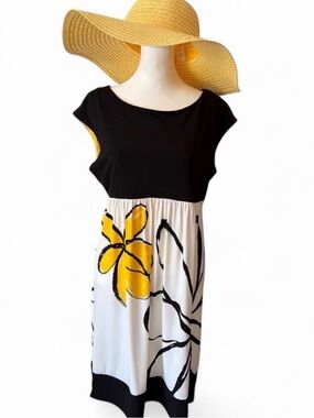 Women’s summer midi dress by B Calm. Black , white and yellow floral. Size 12.